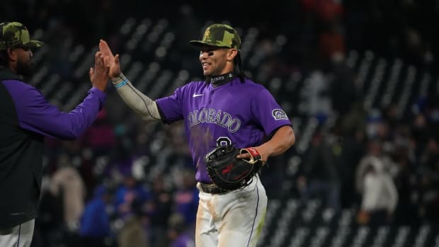 May 21, 2022; Denver, Colorado, USA; Colorado Rockies first baseman Connor Joe (9) celebrates after defeating the New York Mets at Coors Field. Mandatory Credit: Ron Chenoy-USA TODAY Sports